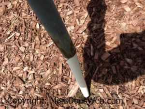 Sliding the Solar-Powered LED Pathway Light Mounted onto a PVC Spike